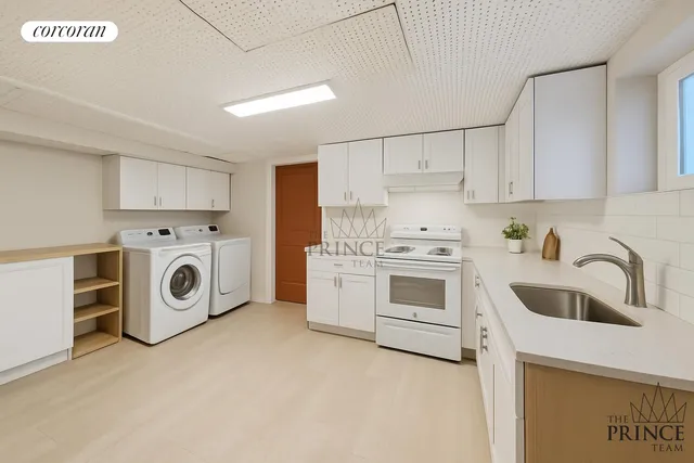 a kitchen with a stove top oven sink and cabinets