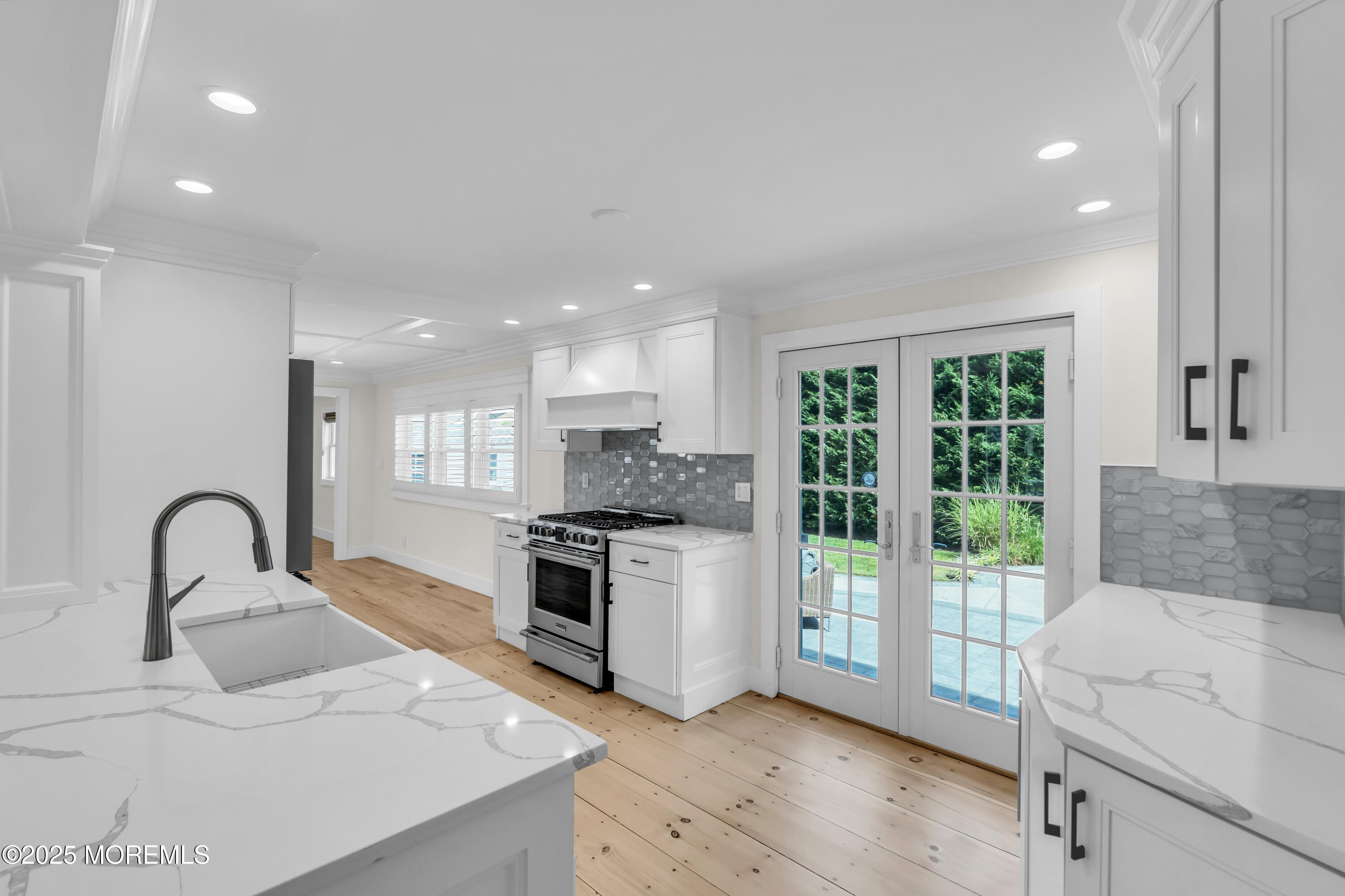 406 Brown Street Brielle, NJ 08730 - Photo 13 of 72 a kitchen with a stove a sink and a refrigerator with wooden floor