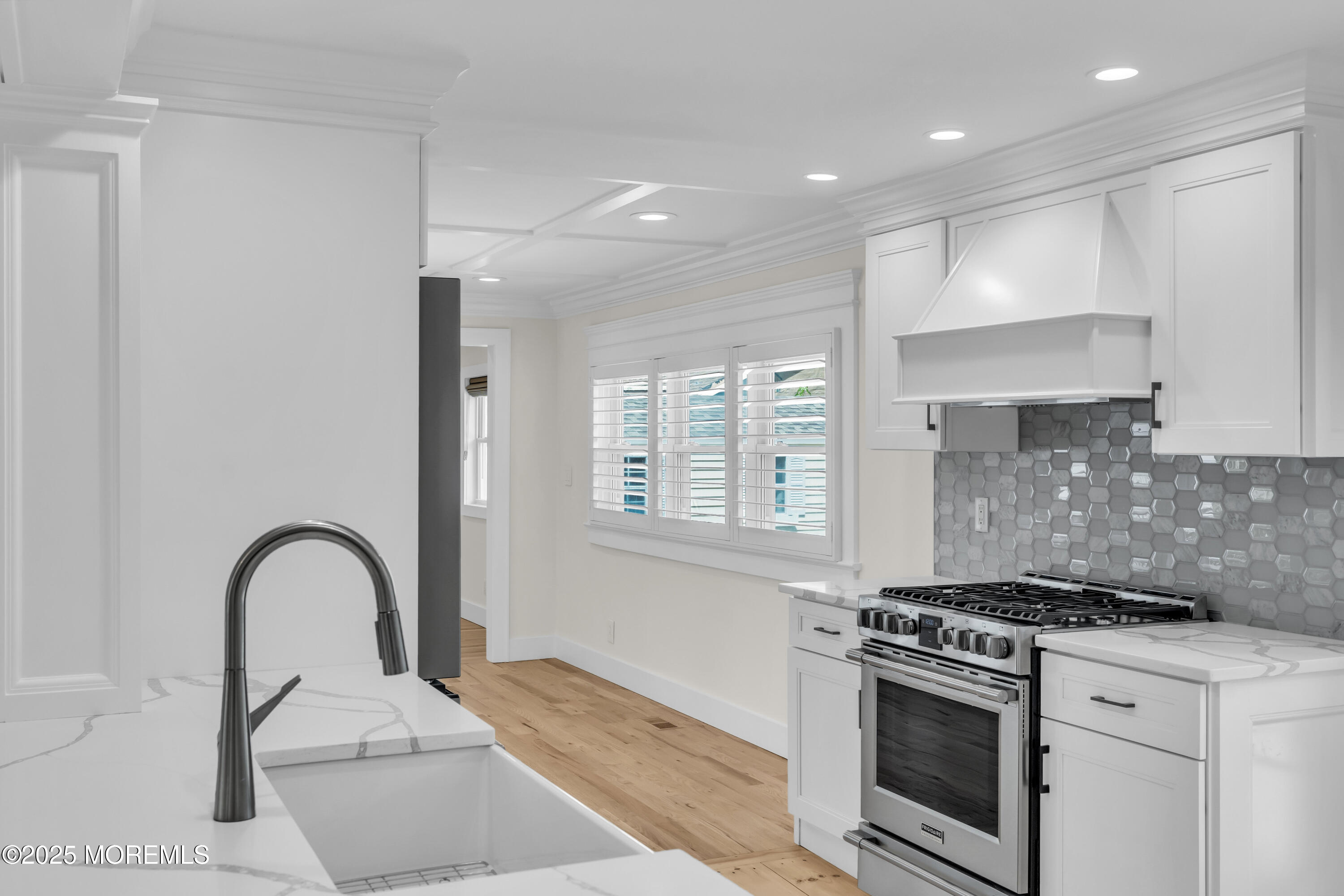 406 Brown Street Brielle, NJ 08730 - Photo 14 of 72 a kitchen with a stove and a white wooden cabinets