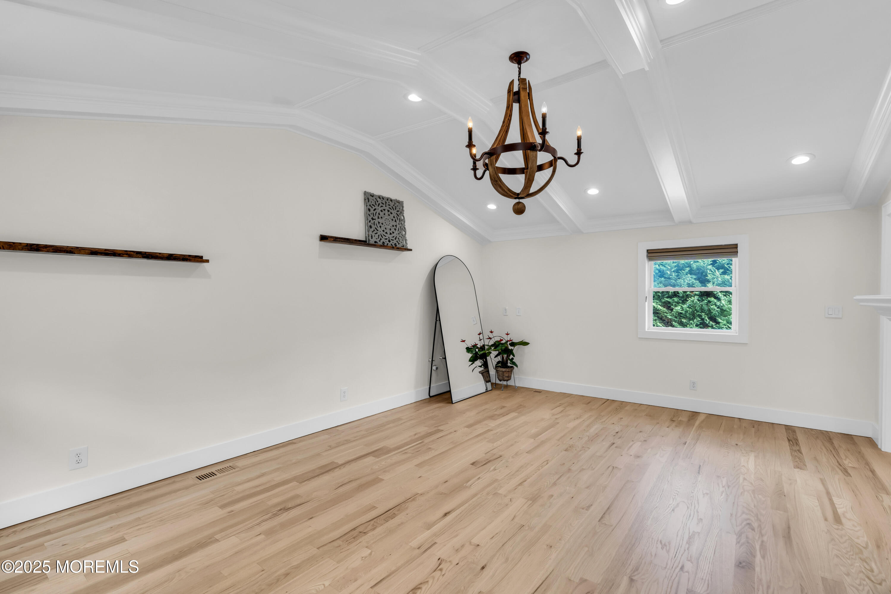 406 Brown Street Brielle, NJ 08730 - Photo 20 of 72 an empty room with wooden floor ceiling fan and windows