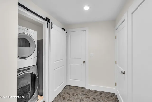 a view of empty room with window and ceiling fan