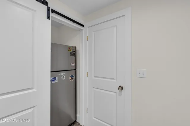 a view of a room that has a window and ceiling fan