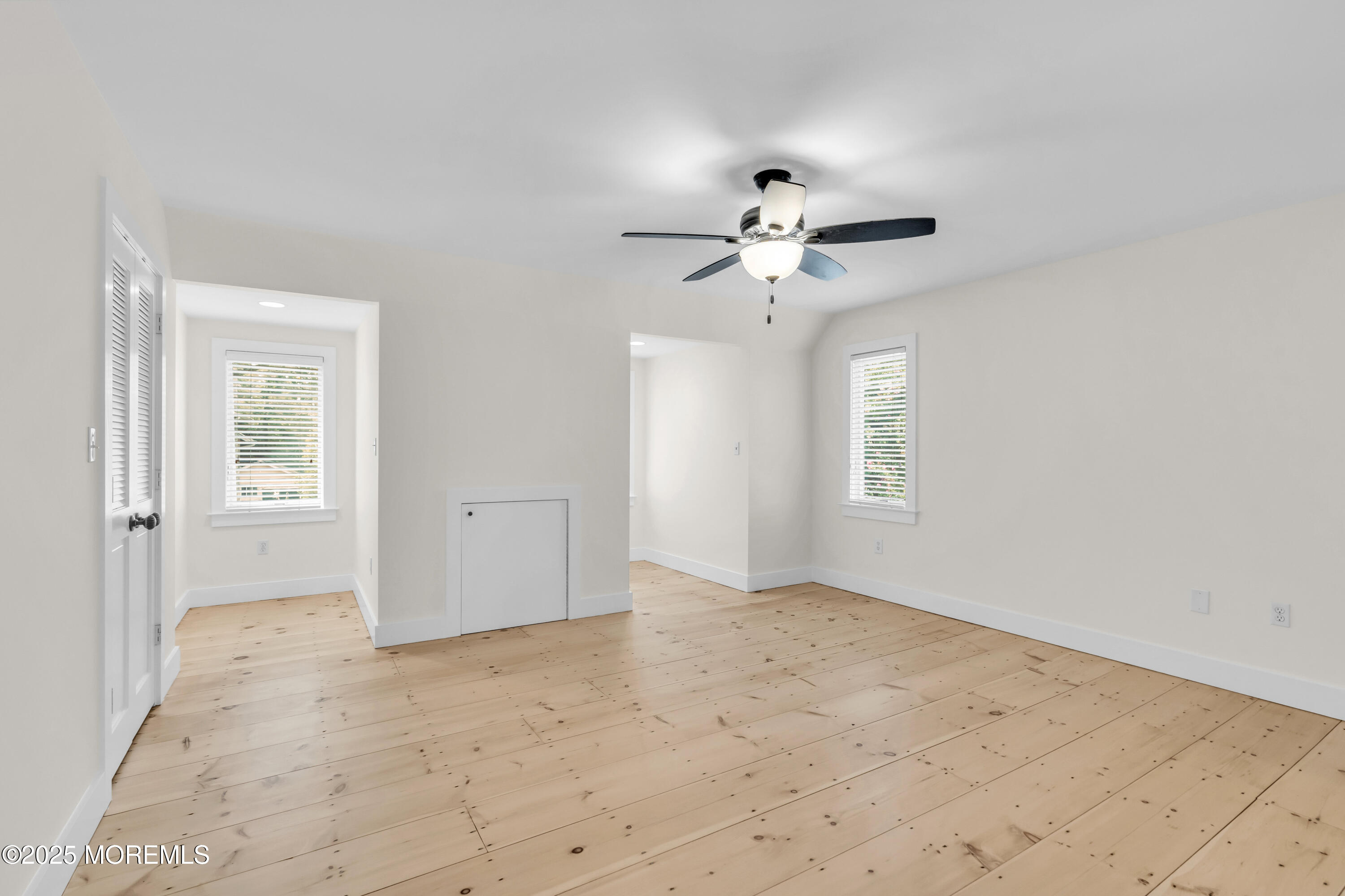 406 Brown Street Brielle, NJ 08730 - Photo 31 of 72 an empty room with windows and ceiling fan