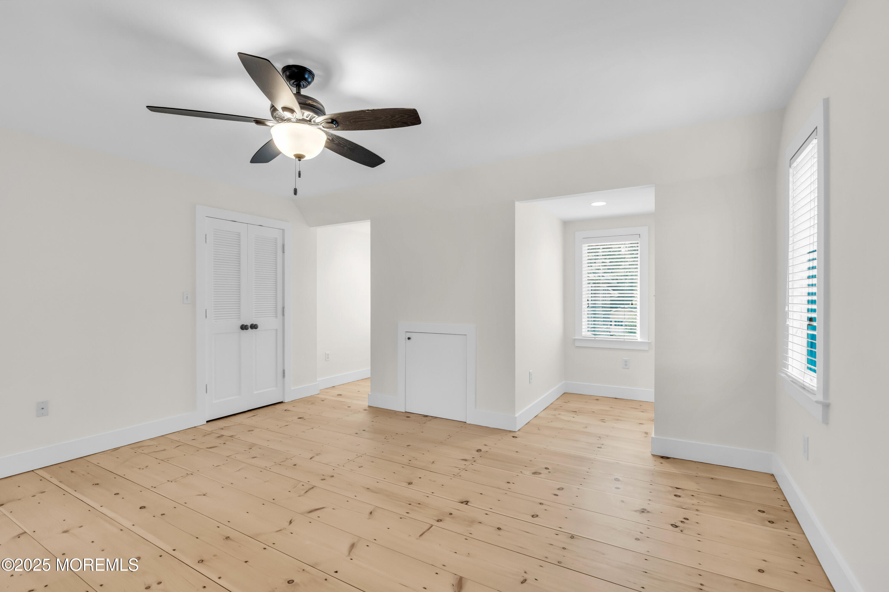 406 Brown Street Brielle, NJ 08730 - Photo 32 of 72 a view of empty room with window and ceiling fan