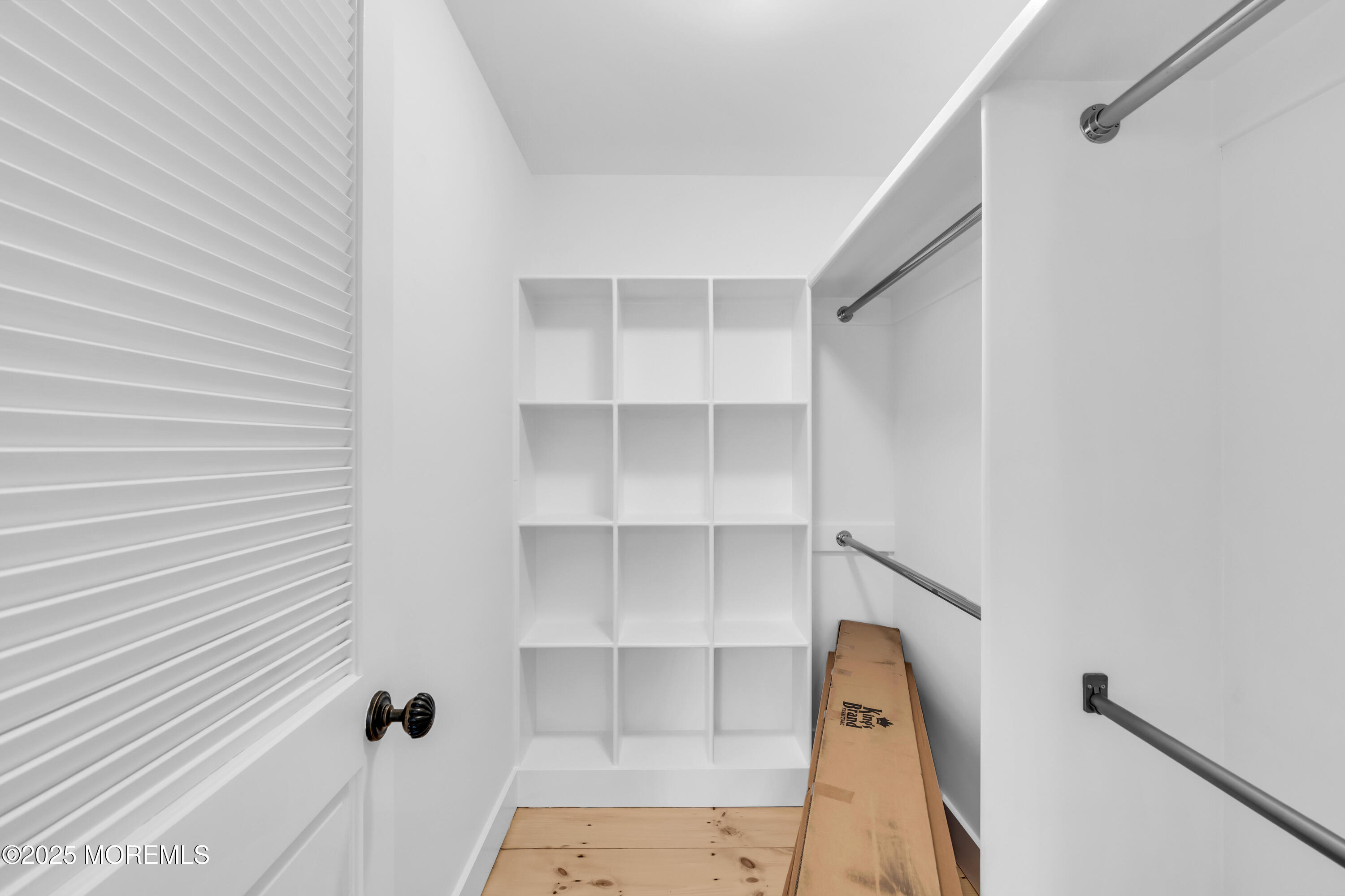 406 Brown Street Brielle, NJ 08730 - Photo 35 of 72 a view of walk in closet with empty racks