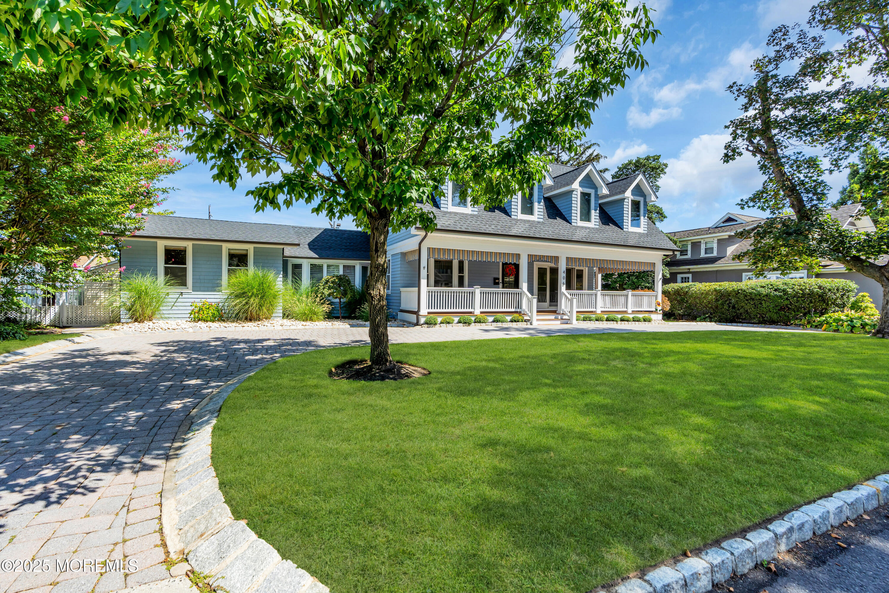 406 Brown Street Brielle, NJ 08730 - Photo 4 of 72 a front view of a house with a yard