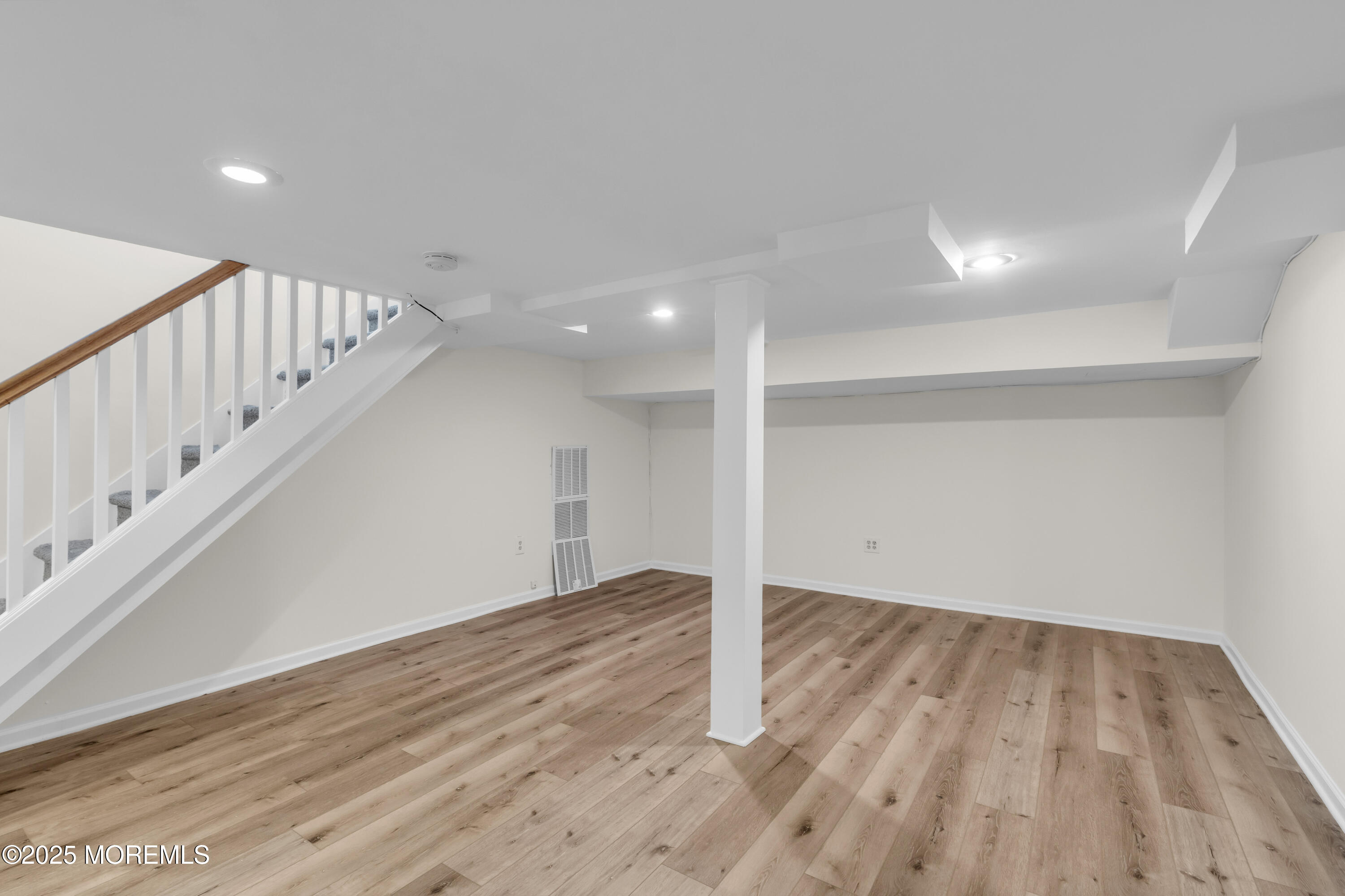 406 Brown Street Brielle, NJ 08730 - Photo 42 of 72 a view of an empty room with wooden floor