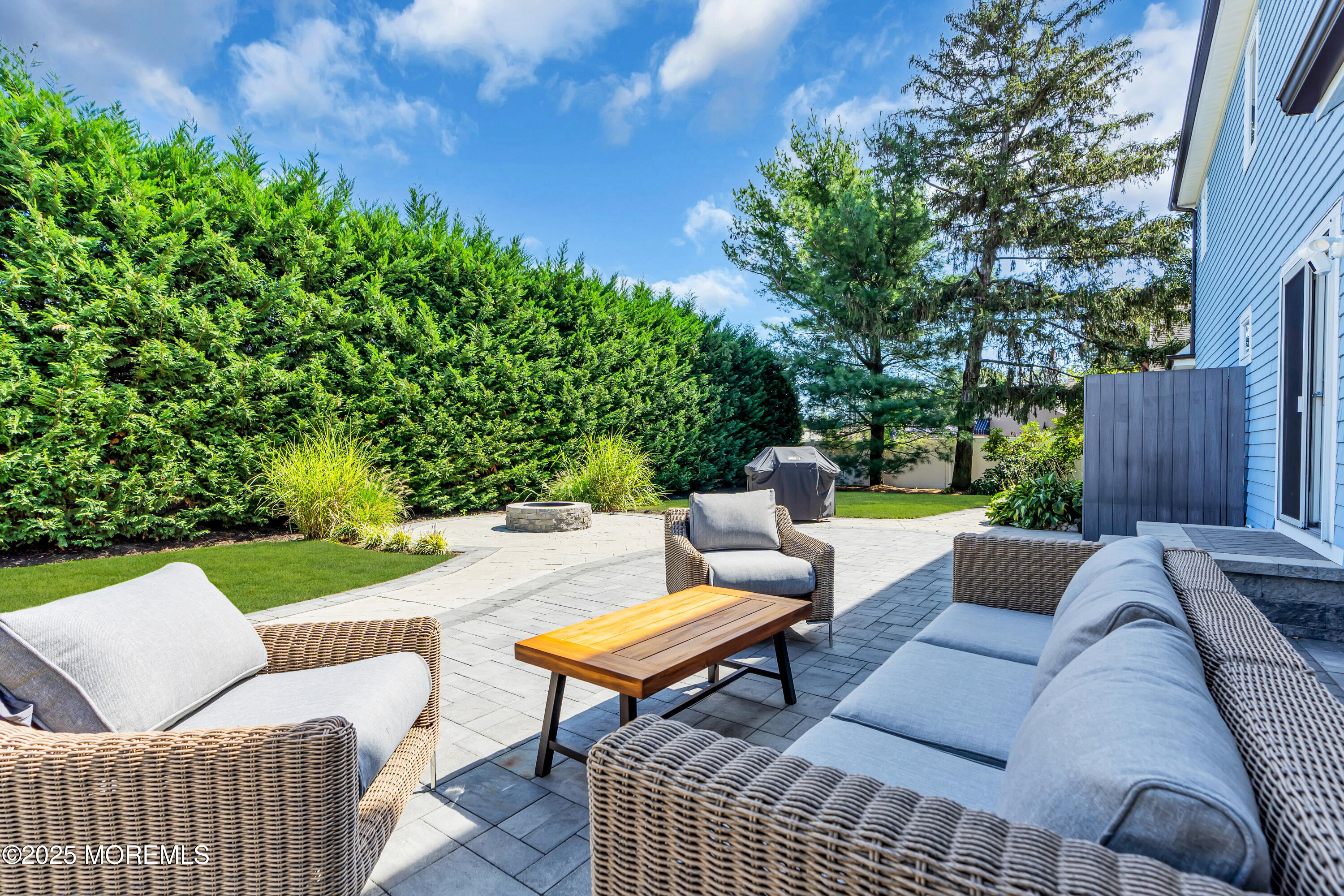 406 Brown Street Brielle, NJ 08730 - Photo 48 of 72 a outdoor living space with furniture and a garden