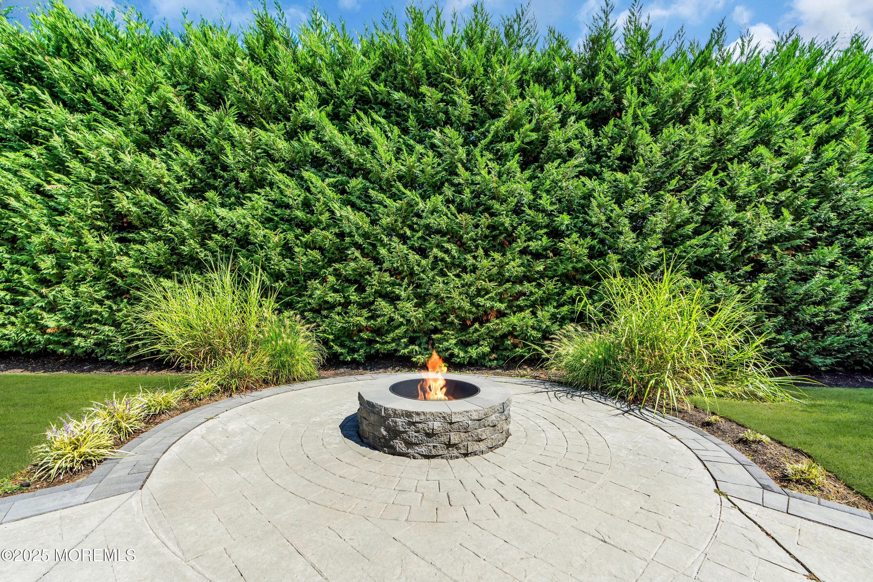 406 Brown Street Brielle, NJ 08730 - Photo 50 of 72 a backyard of a house with a yard and outdoor seating