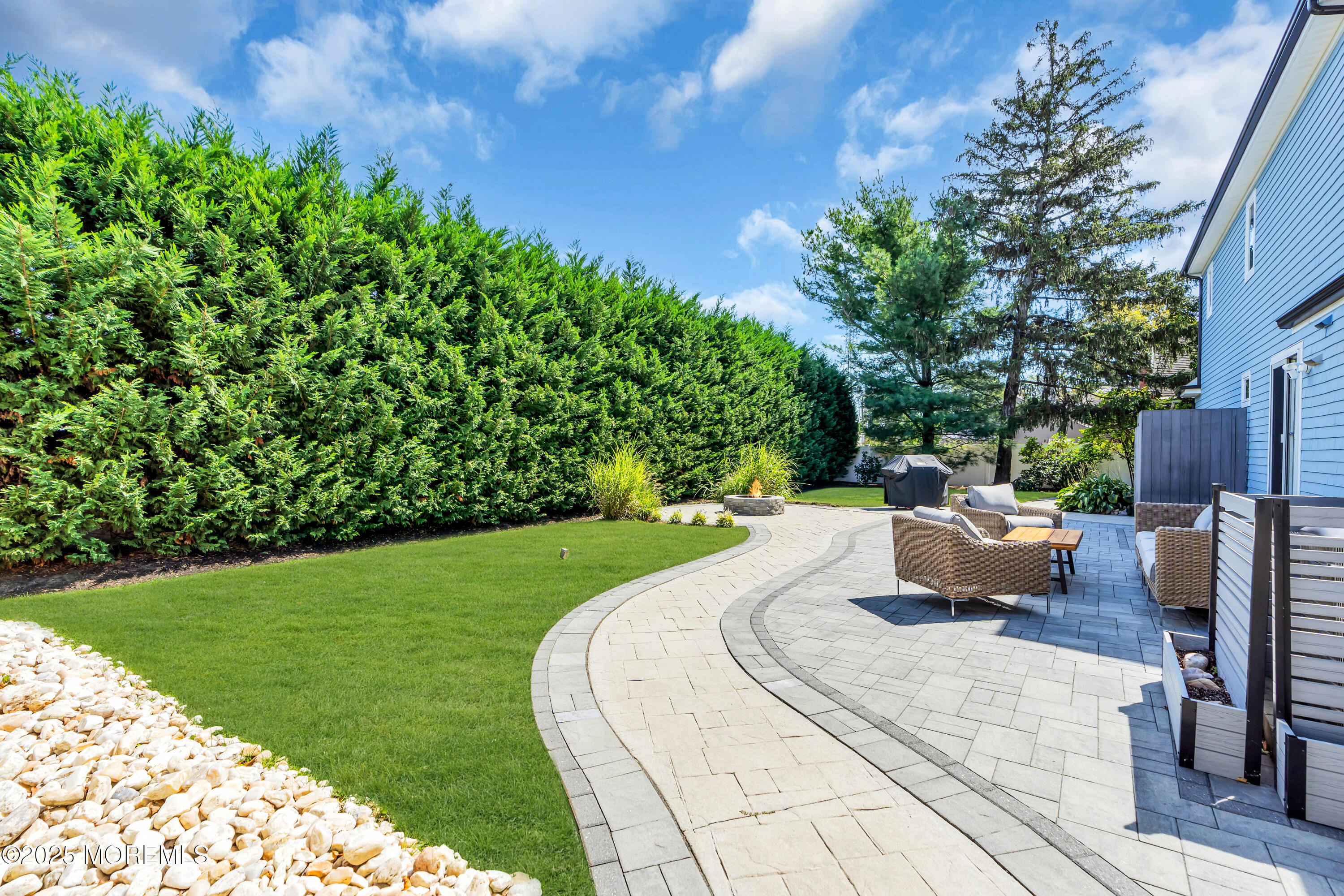 406 Brown Street Brielle, NJ 08730 - Photo 51 of 72 a view of a backyard with sitting area