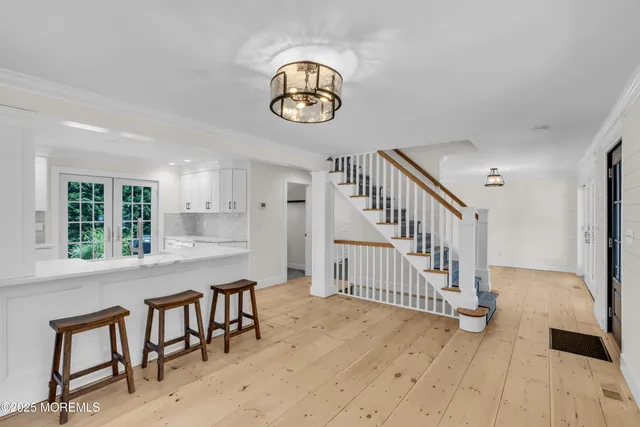 a kitchen with white cabinets and appliances