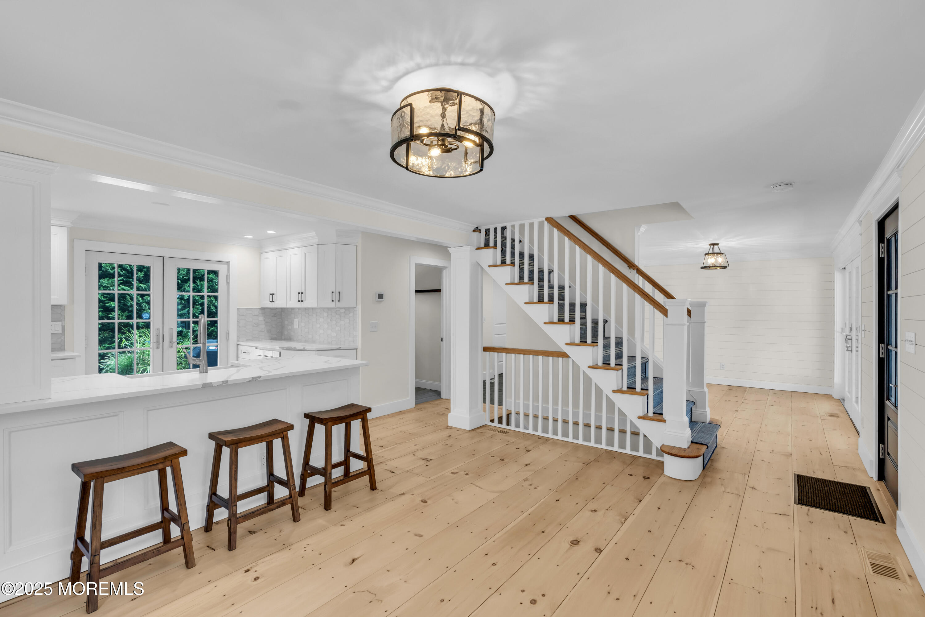 406 Brown Street Brielle, NJ 08730 - Photo 9 of 72 a view of dining room and hall with wooden floor