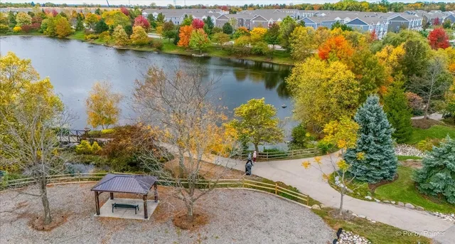 an aerial view of a house with a lake view