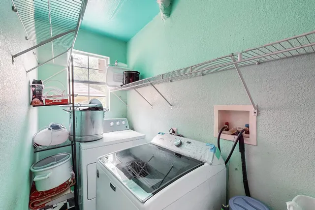a utility room with dryer and washer