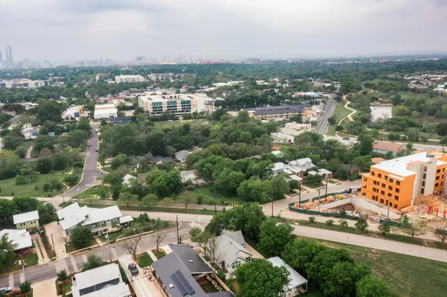 an aerial view of a city with lots of residential buildings