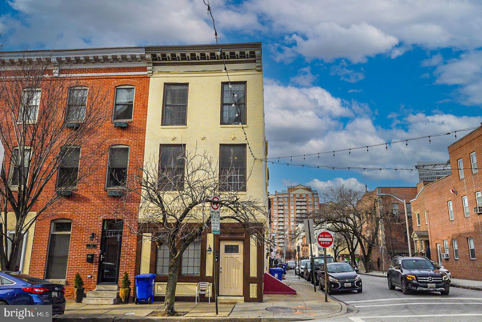 230 South Exeter Street Baltimore, MD 21202 - Photo 2 of 2 a view of a building with car parked