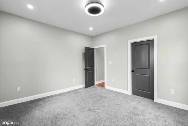 a bathroom with a glass shower door