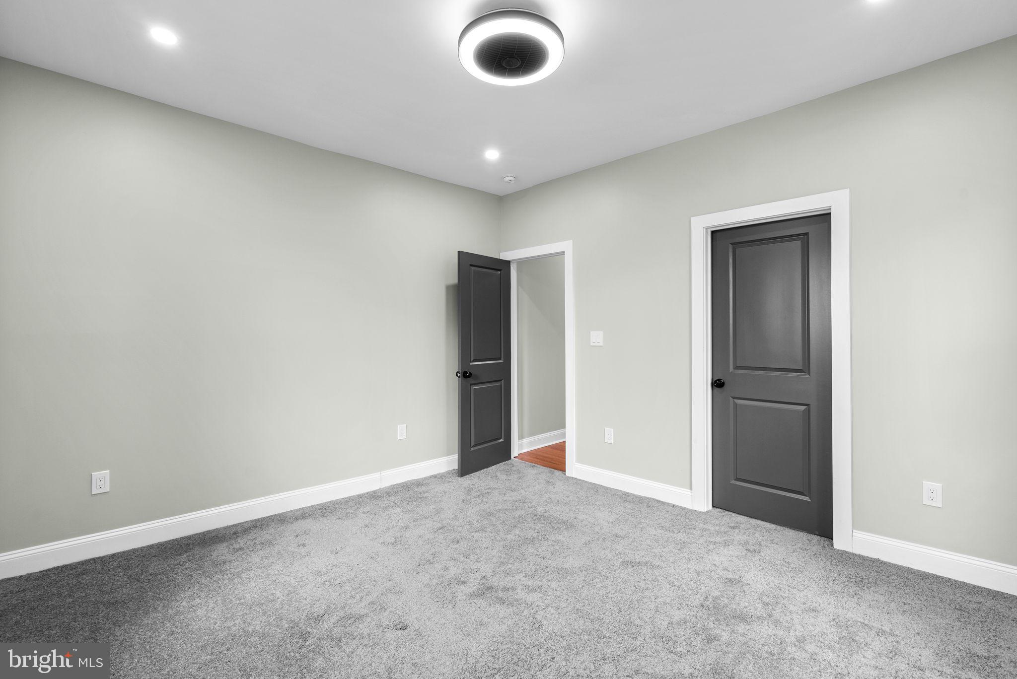 4313 Wentworth Road Baltimore, MD 21207 - Photo 23 of 46 an empty room with closet and fan