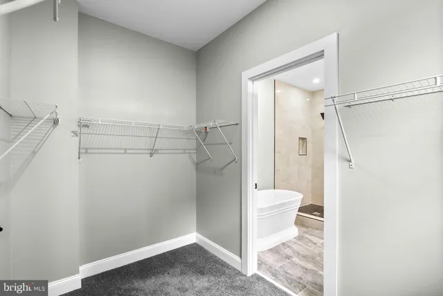 a bathroom with a toilet a sink and a mirror