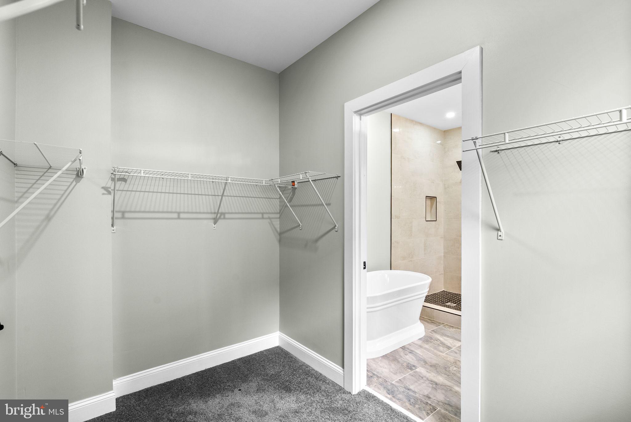 4313 Wentworth Road Baltimore, MD 21207 - Photo 24 of 46 a bathroom with a glass shower door