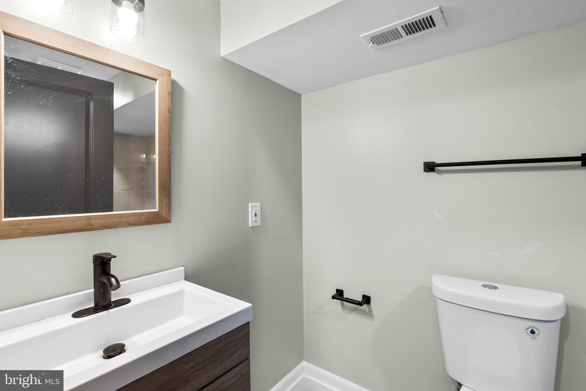 4313 Wentworth Road Baltimore, MD 21207 - Photo 34 of 46 a bathroom with a sink and a toilet