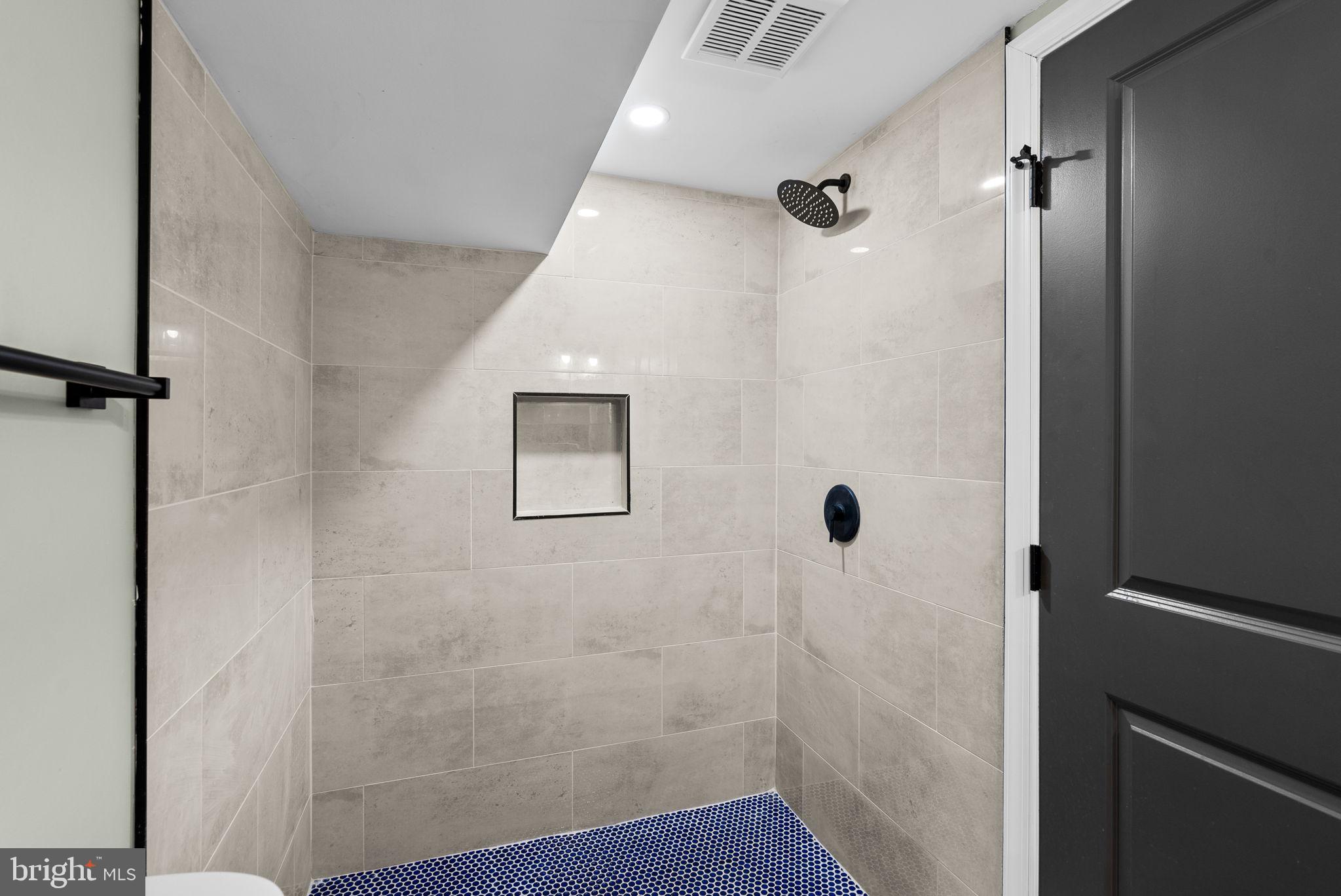 4313 Wentworth Road Baltimore, MD 21207 - Photo 35 of 46 a bathroom with a shower