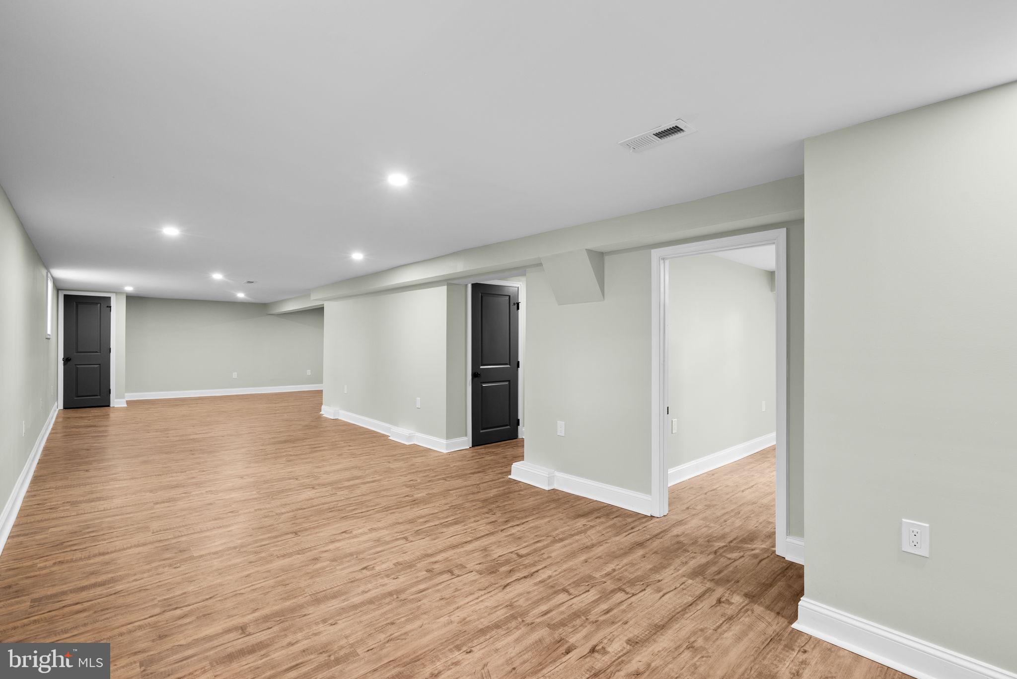 4313 Wentworth Road Baltimore, MD 21207 - Photo 39 of 46 a view of empty room with wooden floor