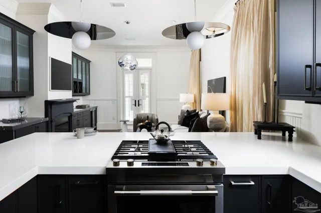 a kitchen with a stove and a refrigerator