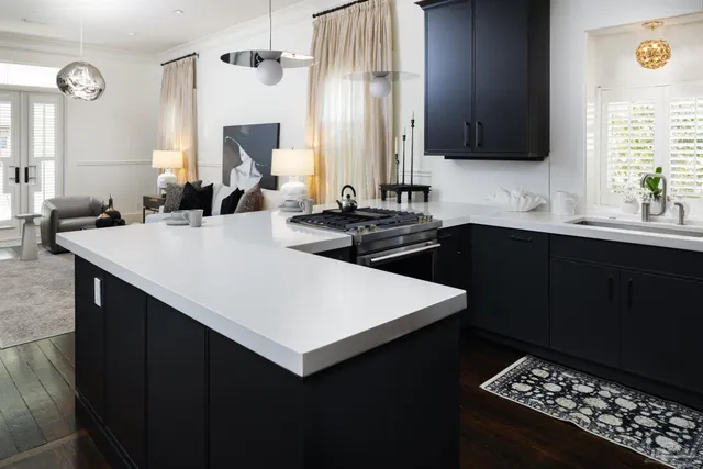 a kitchen with a sink stove and cabinets