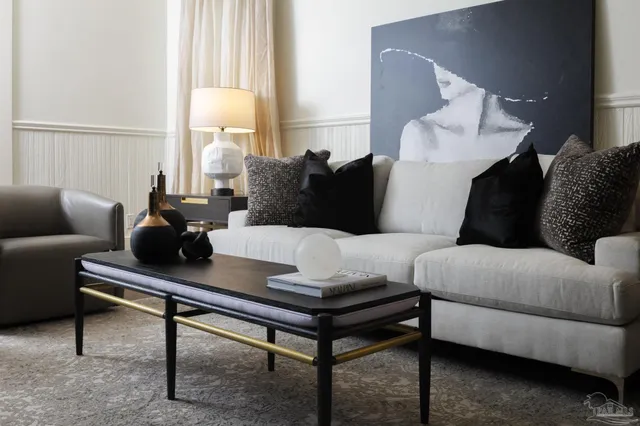 a living room with furniture and a window