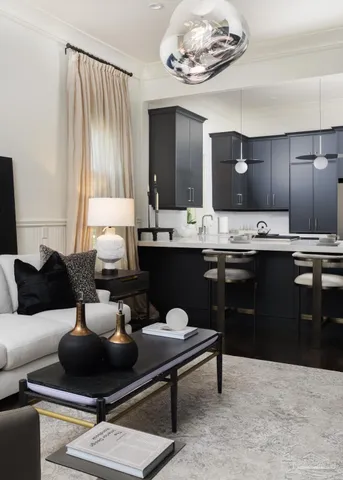 a living room with furniture and a large mirror