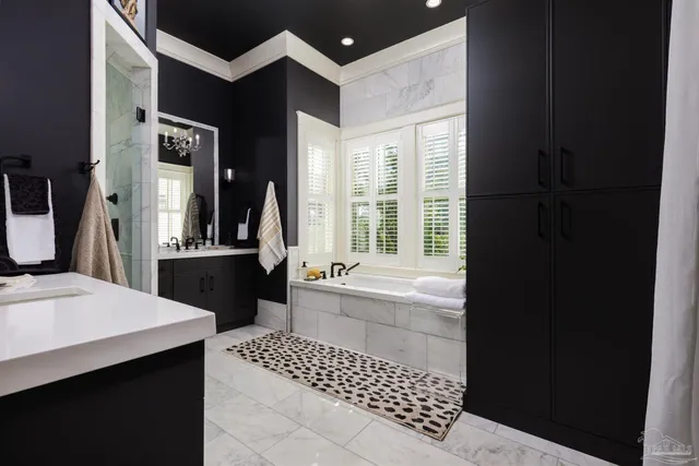 a bathroom with a bathtub shower sink and toilet