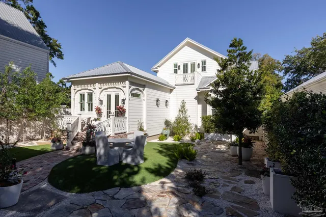 a front view of a house with garden