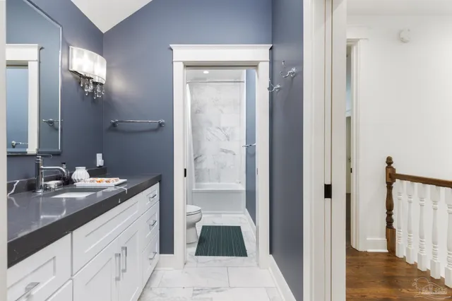 a living room with a couch and a rug