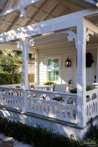 a living room with a couch and a chandelier