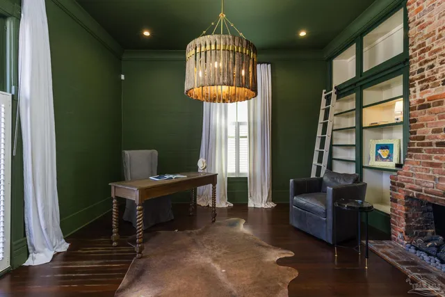 a workspace with furniture window and wooden floor