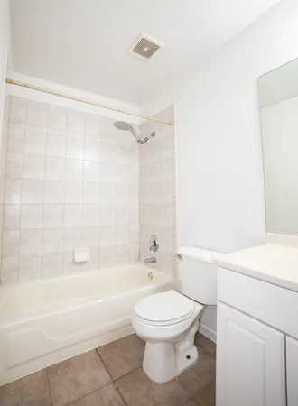 a bathroom with a toilet a sink and a bathtub