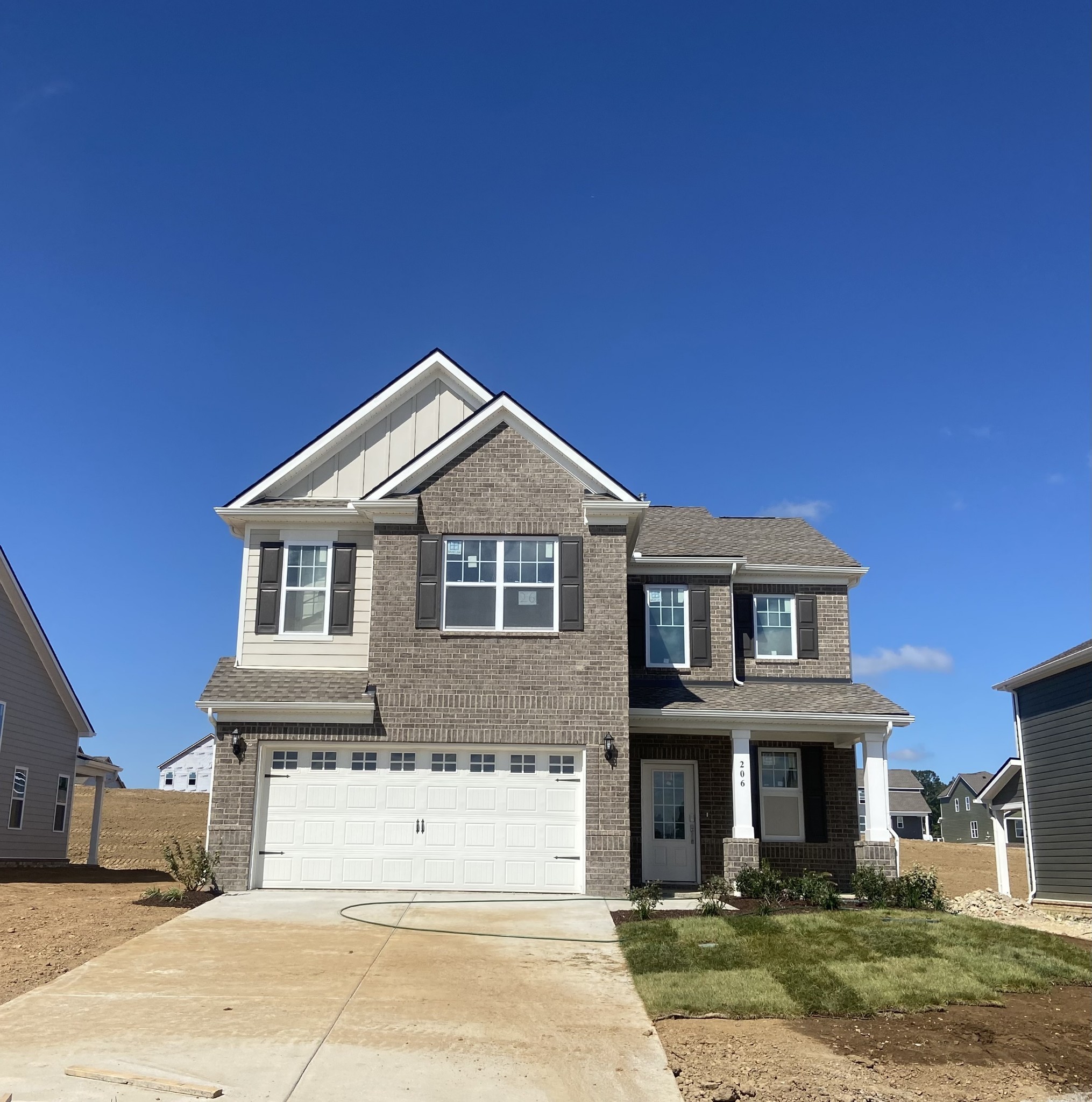 206 Goldfinch Rd Mount Mount Juliet, TN 37122 - Photo 1 of 15 a front view of a house with a yard
