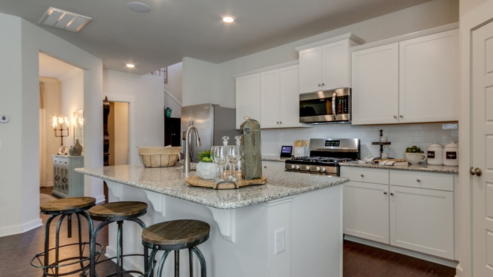 206 Goldfinch Rd Mount Mount Juliet, TN 37122 - Photo 4 of 15 a kitchen with stainless steel appliances granite countertop a stove a sink a refrigerator and white cabinets