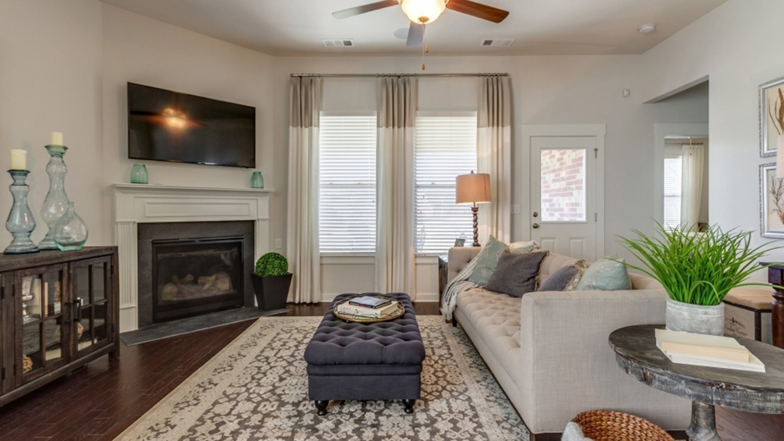 206 Goldfinch Rd Mount Mount Juliet, TN 37122 - Photo 8 of 15 a living room with furniture a flat screen tv and a fireplace