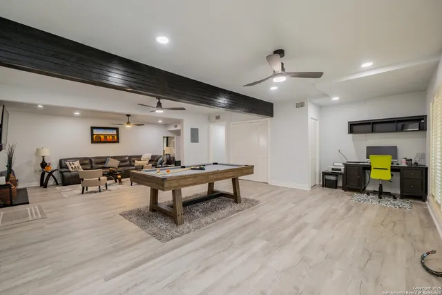 a living room with furniture and a table