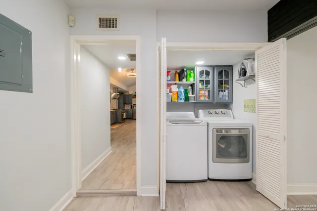 a view of hallway with washer and dryer