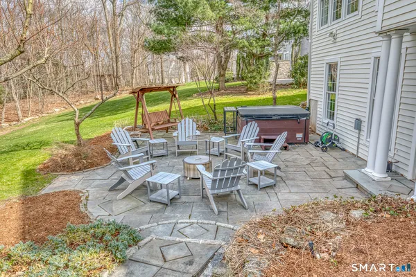 a view of a backyard with large trees