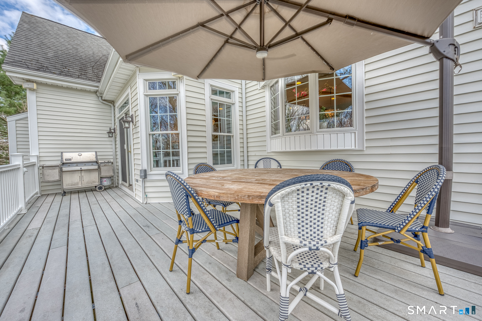133 Feldspar Ridge Glastonbury, CT 06033 - Photo 19 of 56 a view of a patio with table and chairs and wooden floor