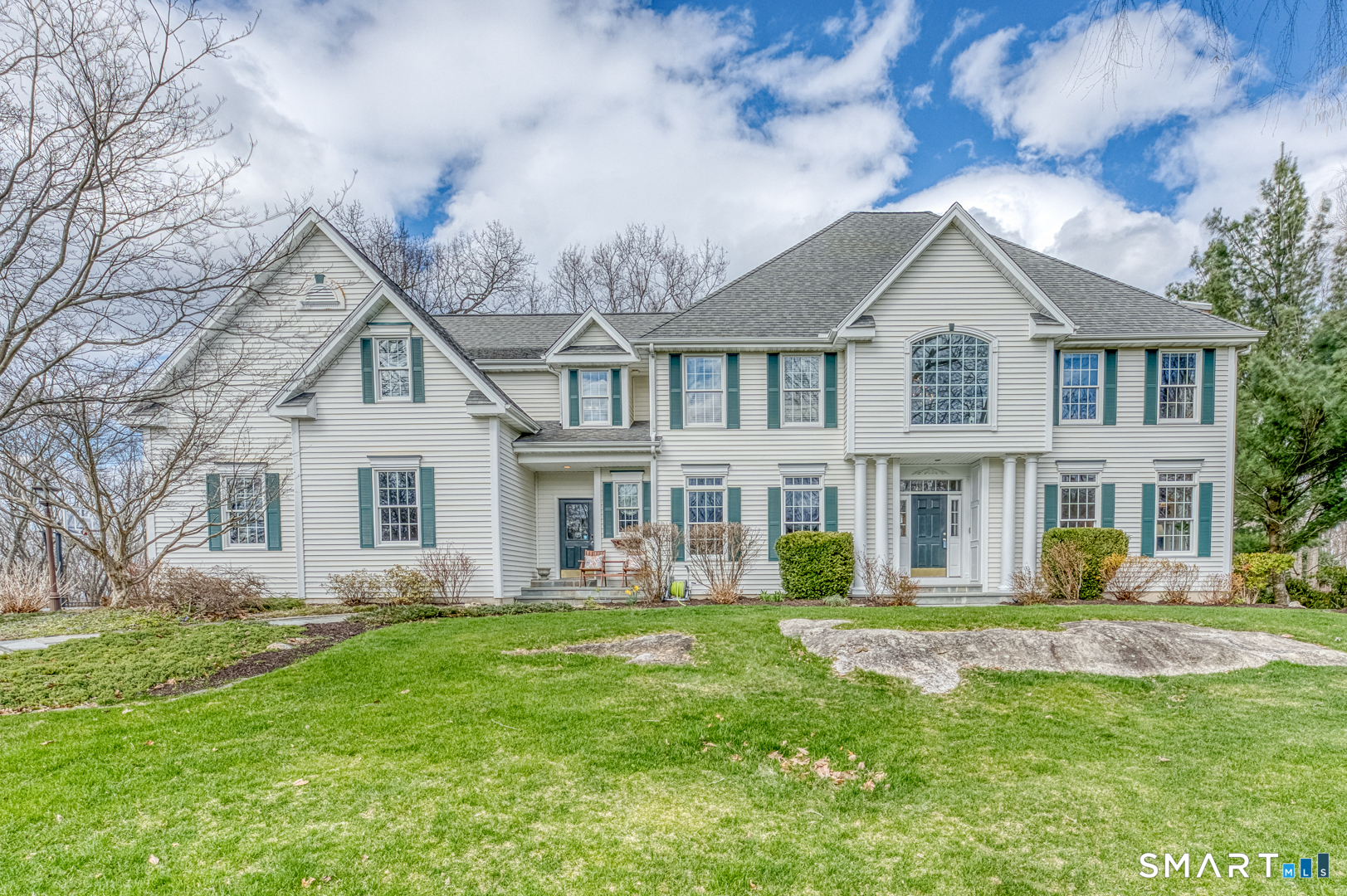 133 Feldspar Ridge Glastonbury, CT 06033 - Photo 3 of 56 a front view of a house with a garden and trees