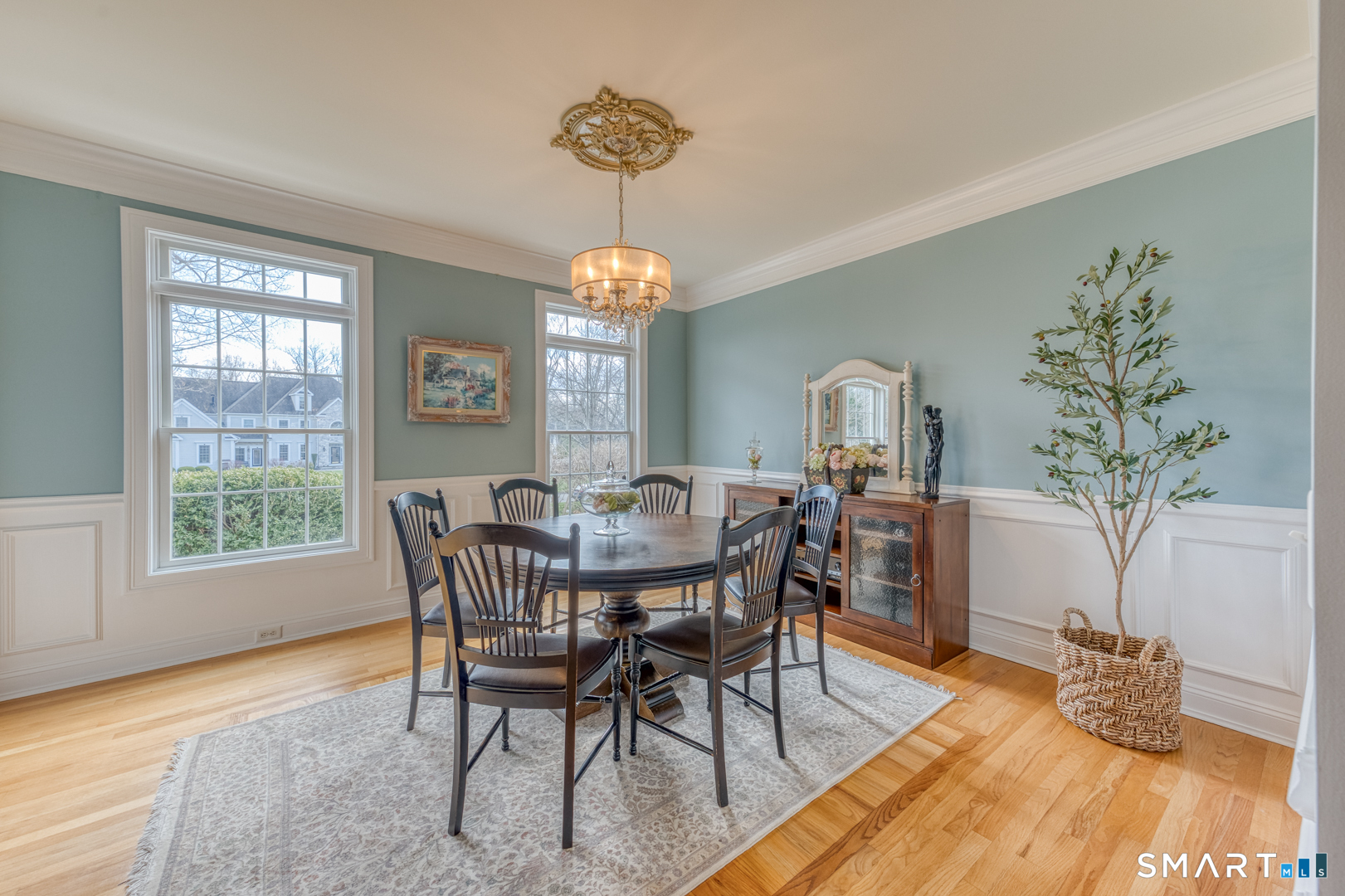 133 Feldspar Ridge Glastonbury, CT 06033 - Photo 31 of 56 a view of a dining room with furniture window and wooden floor