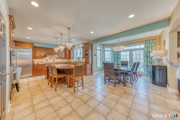 a view of kitchen with furniture and wooden floor