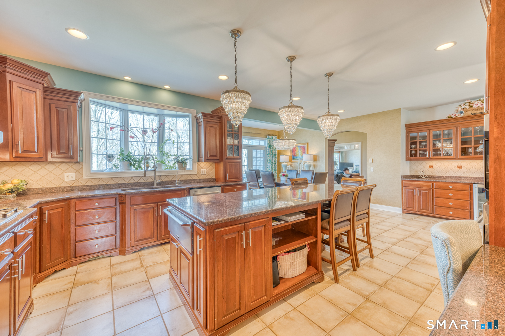 133 Feldspar Ridge Glastonbury, CT 06033 - Photo 35 of 56 a kitchen with stainless steel appliances granite countertop a sink and a refrigerator