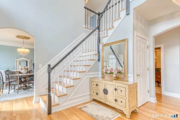 a bedroom with furniture and a chandelier