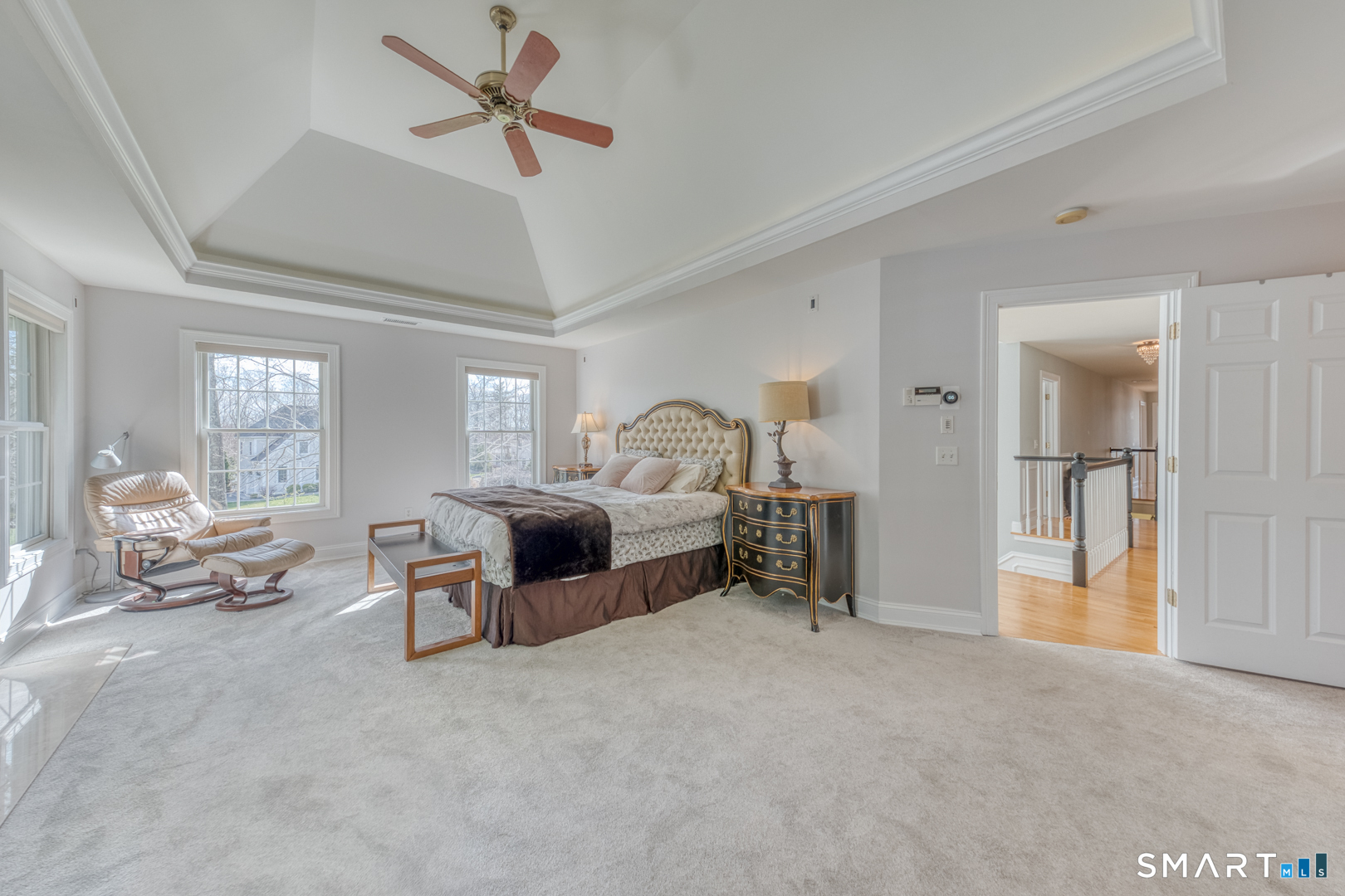133 Feldspar Ridge Glastonbury, CT 06033 - Photo 41 of 56 a bedroom with furniture and a chandelier